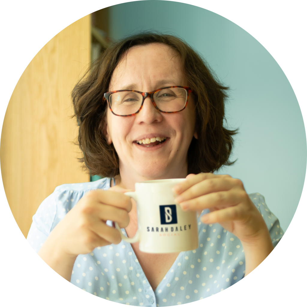 Sarah Daley Social Media Manager smiling holding mug
